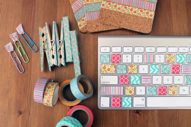 paper clips, coasters, pins and a mac keyboard decorated in patterned tape